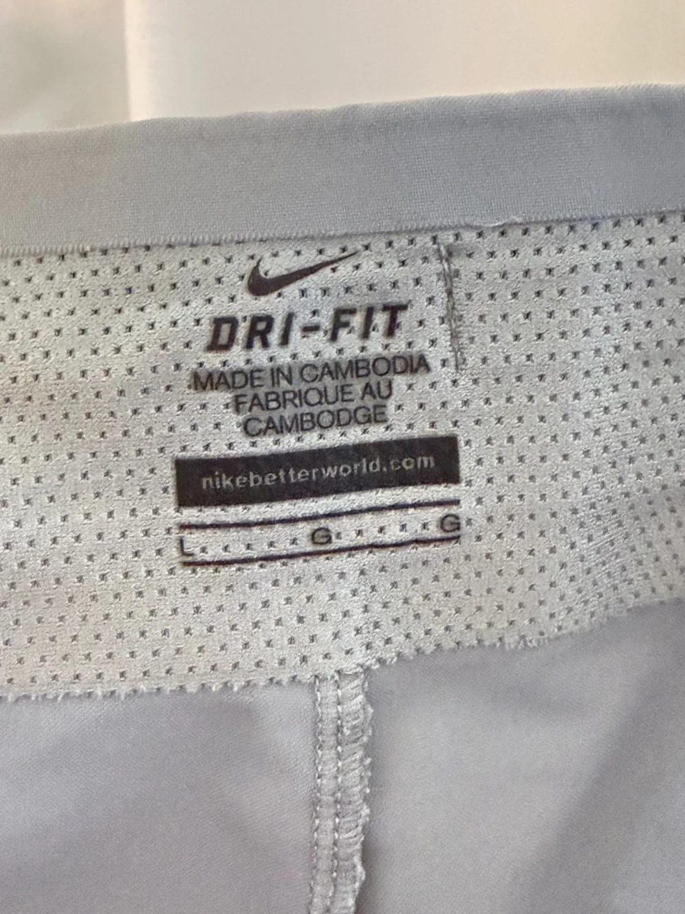 Nike Light Gray Athletic Shorts with Green Side Stripe